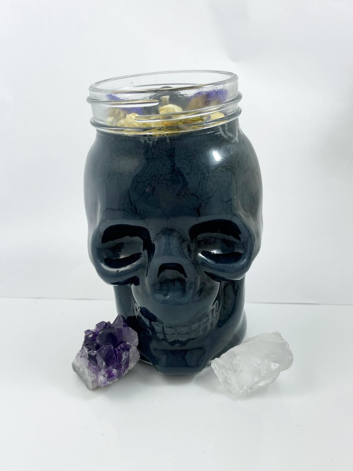 Black glass skull candle with crystals